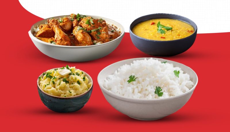 A delicious combo of chicken curry with plain rice or naan, paired with daal and spiced vorta for a flavorful meal.